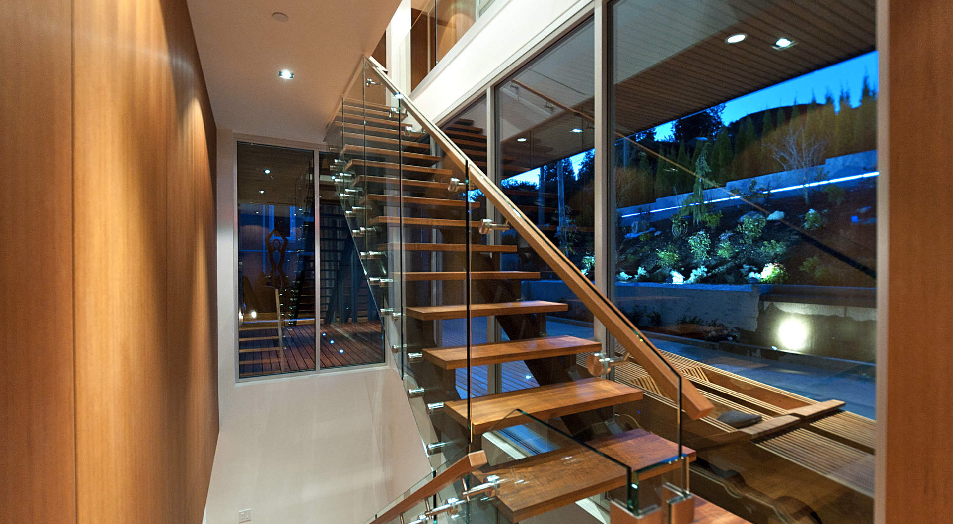 Custom Staircase Made of Glass, Steel, and Teak Treads
