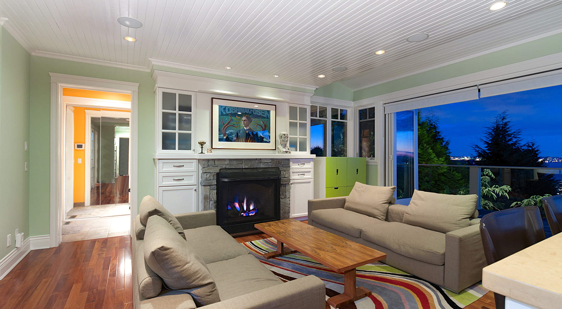 Family Room with "Eclipse" Doors and Roaring Fireplace