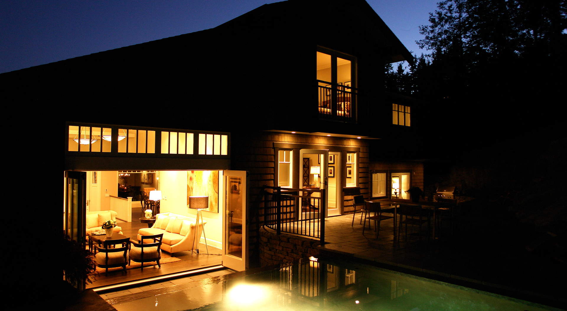 Pool Illuminated Overlooking the Home