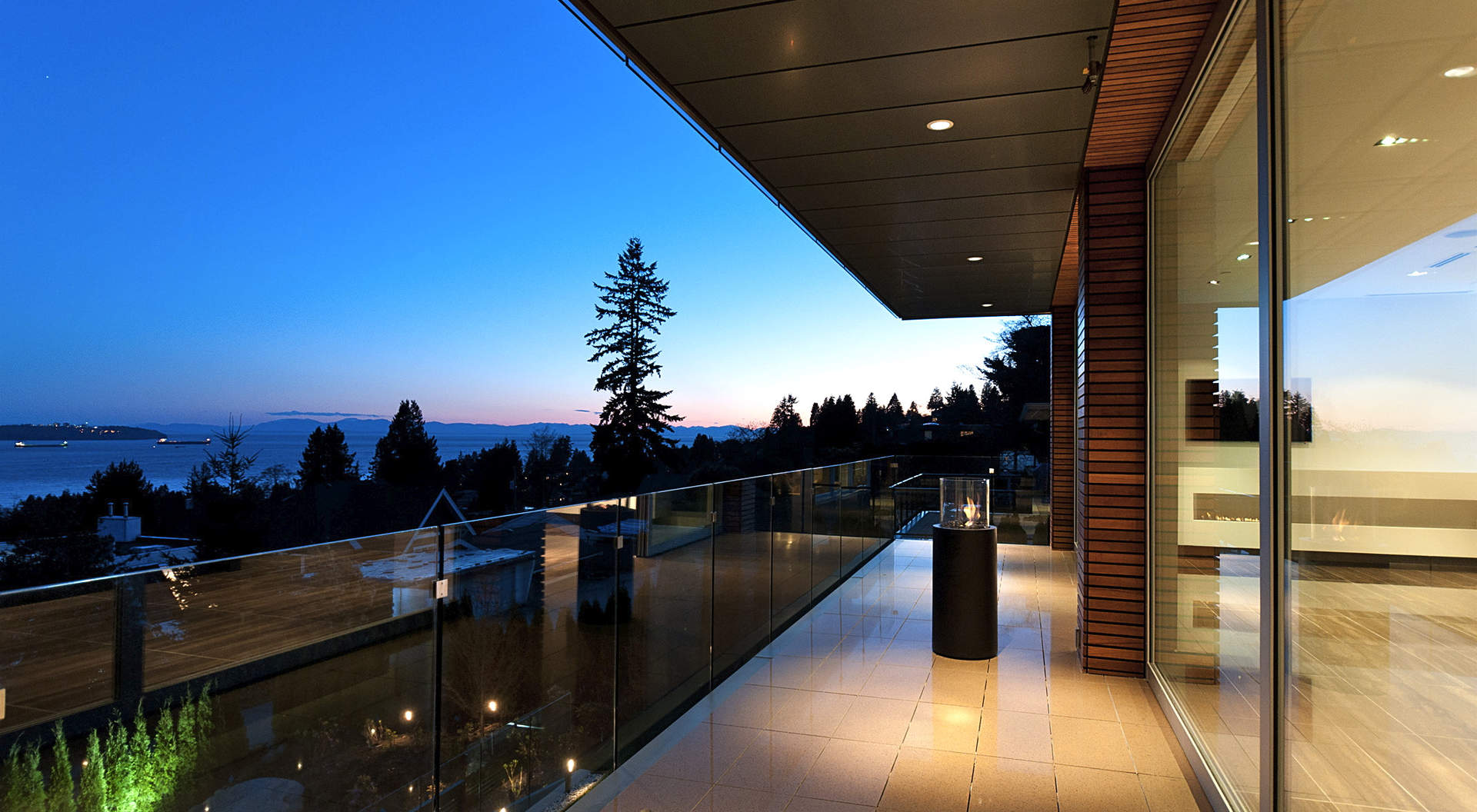 Sensational Outdoor Terrace with Ethanol Fireplaces and Seamless Glass